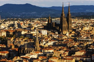 Photo of panoramic view of the city of Clermont-Ferrand with its cathedral, France.