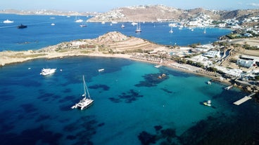 Photo of aerial view of the beautiful beach of Agios Ioannis Diakoftis on the island of Mykonos, Greece.