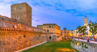 Photo of panoramic view of the ancient town of Matera (Sassi di Matera), European Capital of Culture 2019, in beautiful golden morning light with blue sky and clouds, Basilicata, southern Italy.