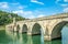 Photo of the Mehmed Pasa Sokolovic Bridge over the Drina River in Visegrad, Bosnia and Herzegovina.