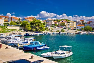 Photo of aerial view of Brodarica village near Sibenik beach and coastline, Dalmatia region of Croatia.