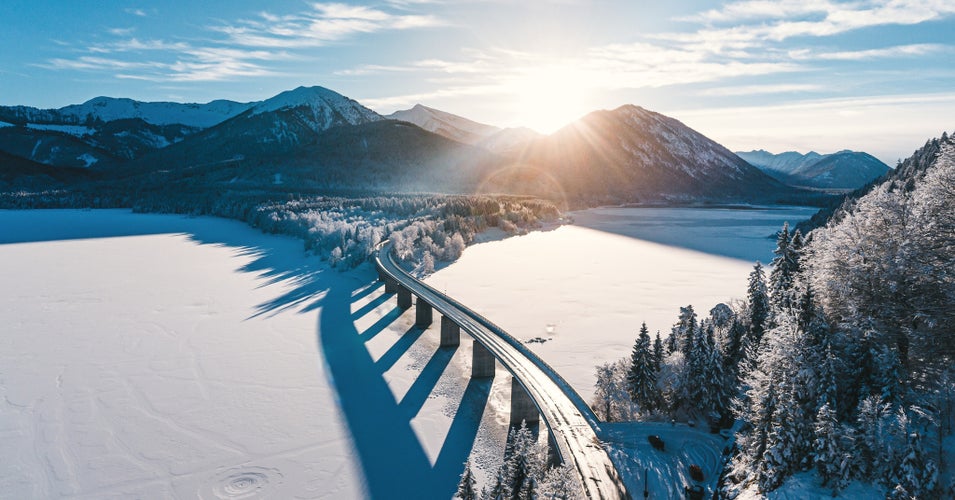 winter aerial view of the lake sylvenstein in the bavarian karwendel mountains.