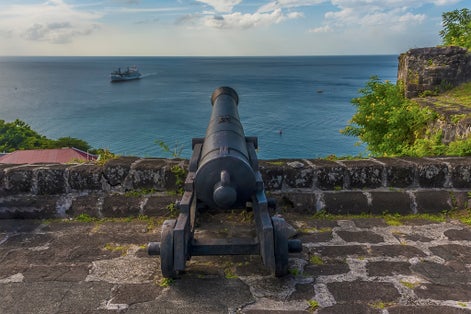 Photo of A view looking out to sea from Fort St George in Grenada .