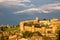 Photo of Sunset with cloudy sky over the medieval walled city, Avila, Spain.