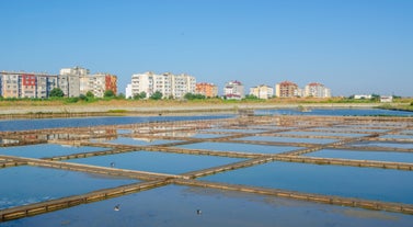 Photo of panoramic aerial view over small ancient resort town of Pomorie with old European small houses , Bulgaria.