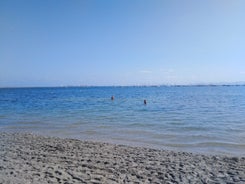 Photo of Beach seashore with wooden path to sea water in San Pedro del Pinatar