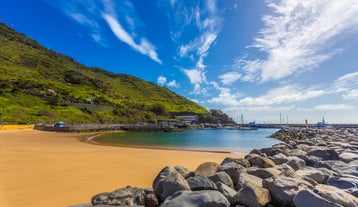 Photo of beach aerial view of Machico bay and Cristiano Ronaldo International airport in Madeira, Portugal.