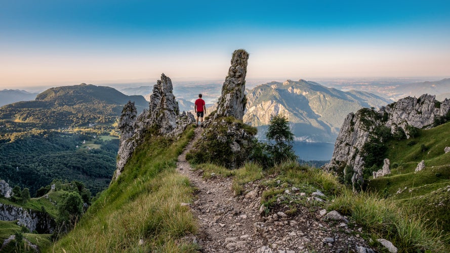 Me near the top of the Grigna Mountain, over Lecco and lake of Como. Nice sunrise, light blue sky and a red shirt