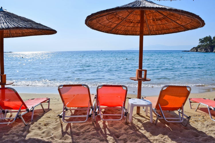 Photo of sun loungers on the beach in Kavala, Greece.