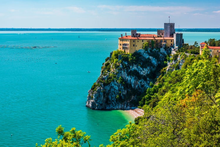 Gulf of Trieste. High cliffs Between boats, karst rocks and ancient castles. Duino. Italy.