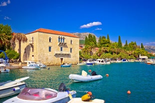 photo of a beautiful panoramic view of Kastel Luksic harbor and landmarks summer view, Split region of Dalmatia, Croatia.