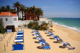 photo of an aerial view of wide sandy beach in touristic resorts of Quarteira and Vilamoura, Algarve, Portugal.