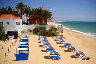 Photo of wide sandy beach in white city of Albufeira, Algarve, Portugal.