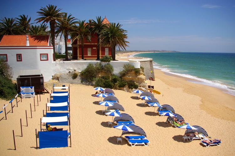 Photo of Armação de Pera beach in Algarve, Portugal.