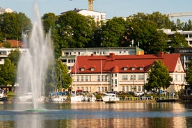 Aerial view of the Tampere city at sunset. Tampella building. View over Tammerkoski river in warm sunlight.