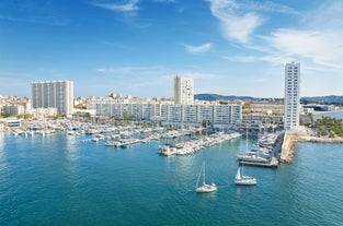 Photo of aerial cityscape view on French riviera with yachts in Cannes city, France.