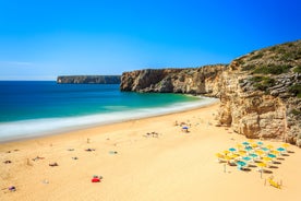 Photo of aerial view of beautiful lighthouse located on high cliffs of Saint Vincent cape in Sagres, Algarve, Portugal.