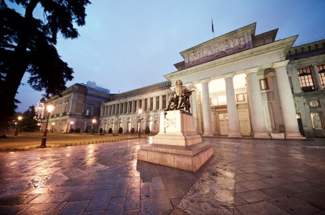 Photo of the Prado Museum at night, Madrid, Spain.