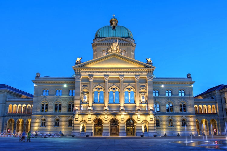 Photo of night view of the Federal Palace in Bern, Switzerland.