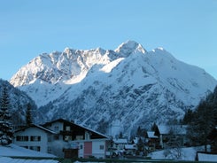 photo of village of Hirschegg in the Kleinwalsertal, Vorarlberg, Austria, with Gottesackerplateau in the background.