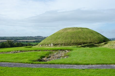 photo of view of Knowth Neolithic Passage Mound Tombs in Boyne Valley, Ireland.