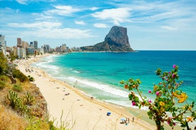 Photo of aerial panoramic view coastline and La Vila Joiosa Villajoyosa touristic resort townscape, sandy beach and Mediterranean seascape, Costa Blanca, Spain.