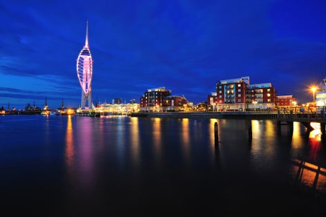 Photo of aerial view of Spinnaker Tower at night and Portsmouth Harbour, England.