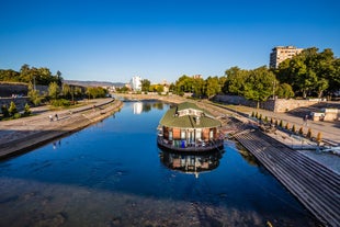 Antique building view in Old Town Bucharest city - capital of Romania and Dambrovita river. Bucharest, Romania, Europe.