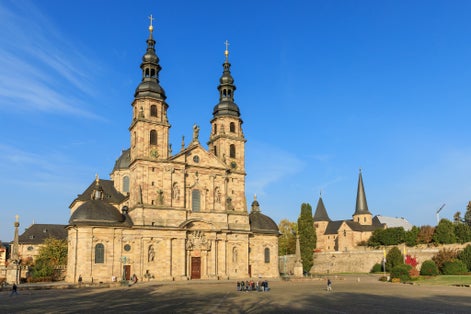 Photo of Fulda Cathedral and the St. Michael's Church in Fulda, Hessen, Germany. The cathedral is built in Baroque and the St. Michael's church in pre-romanesque Carolingian architecture. 