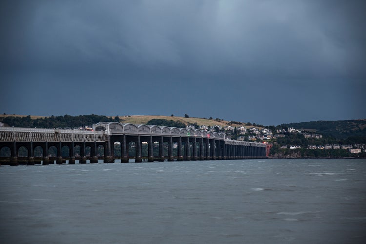 photo of view of Dundee Scotland UK railway bridge in evening.