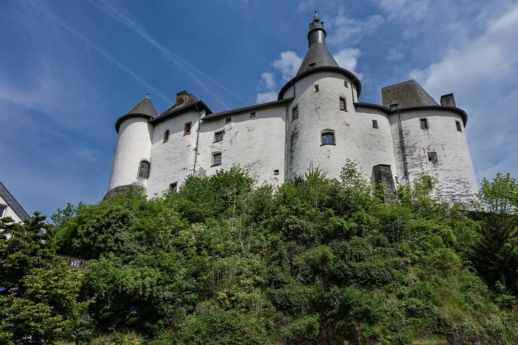 Photo of View of Clervaux Castle (Chateau de Clervaux) in Clervaux in Northern Luxembourg, dates back to XII century. Castle stands at a height of 365 meters on a rocky spur above town. Clervaux, Luxembourg.