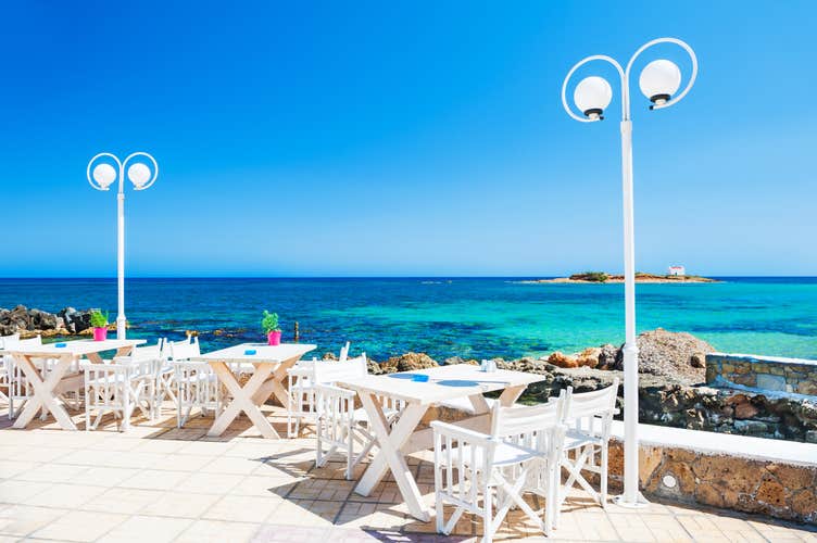 Beautiful tropical beach with turquoise water. Malia, Crete island, Greece.