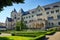 A historic stone imperial castle with a garden in Poznan