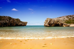 Photo of Ballota beach with the islet Castro, Llanes,  Spain.