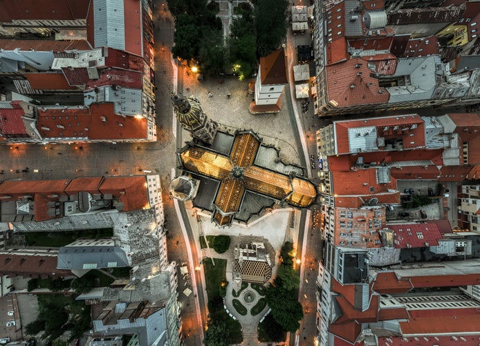 Bird view perspective on Kosice and cross from the golden roof of St Elisabeth's Cathedral.