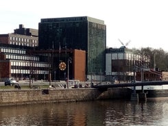 Early autumn morning panorama of the Port of Turku, Finland, with Turku Castle at background.