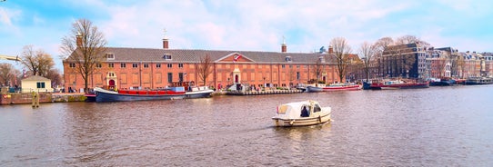 Amsterdam Netherlands dancing houses over river Amstel landmark in old european city spring landscape.