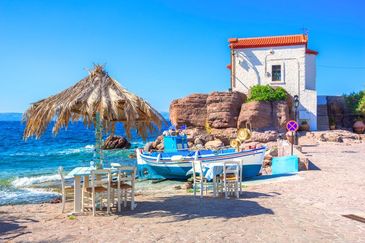 Photo of the little church of Panagia gorgona situated on a rock , seaside village of Lesvos