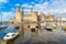 Photo of beautiful view of Caernarfon Castle in Wales in a beautiful summer day.