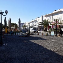 Photo of beautiful White architecture of Oia village on Santorini island, Greece.