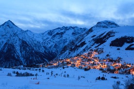 Photo of aerial view of spectacular winter landscape and mountain ski resort in French Alps ,Alpe D Huez, France.