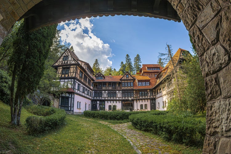 Photo of Peles Castle beautiful famous royal castle and ornamental garden in Sinaia landmark of Carpathian Mountains, Romania.