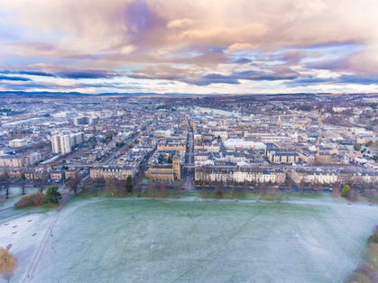 Photo of South Inch Park in Perth Looking onto the city on a frosty morning .