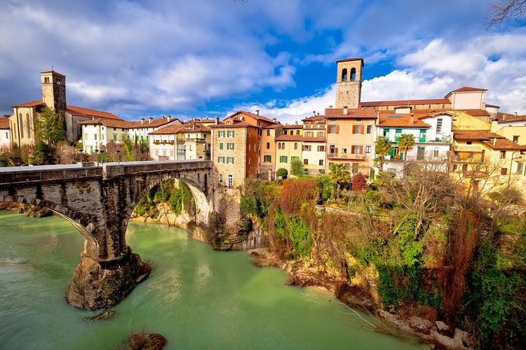 Historic italian landmarks in Cividale del Friuli, Devil's Bridge over green Natisone river, Friuli-Venezia Giulia region of Italy