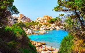 Photo of Bizarre granite rock and azure bay in beautiful beach at Capo Testa, Sardinia, Italy.