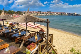 Photo of panoramic aerial view over small ancient resort town of Pomorie with old European small houses , Bulgaria.