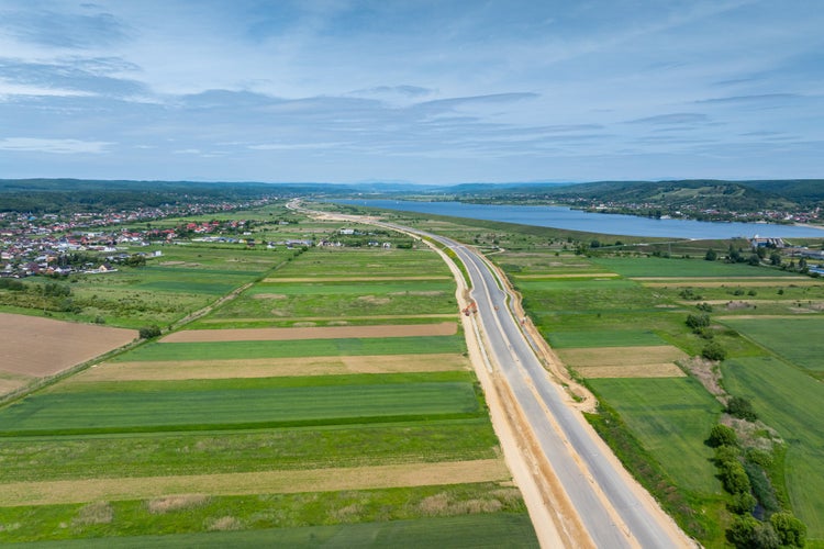 Highways under construction of Romania. Aerial view of A1 Bucuresti Pitesti Curtea de Arges Sibiu highway during construction. High speed roads infrastructure industry.