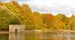 Photo of Autumn landscape with colourful forest, fallen leaves on the grass in Mote Park, Maidstone, England.