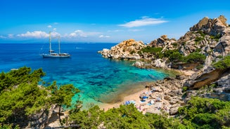 Photo of Bizarre granite rock and azure bay in beautiful beach at Capo Testa, Sardinia, Italy.