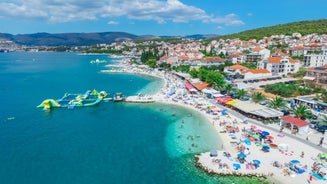 photo of a beautiful panoramic view of Kastel Luksic harbor and landmarks summer view, Split region of Dalmatia, Croatia.